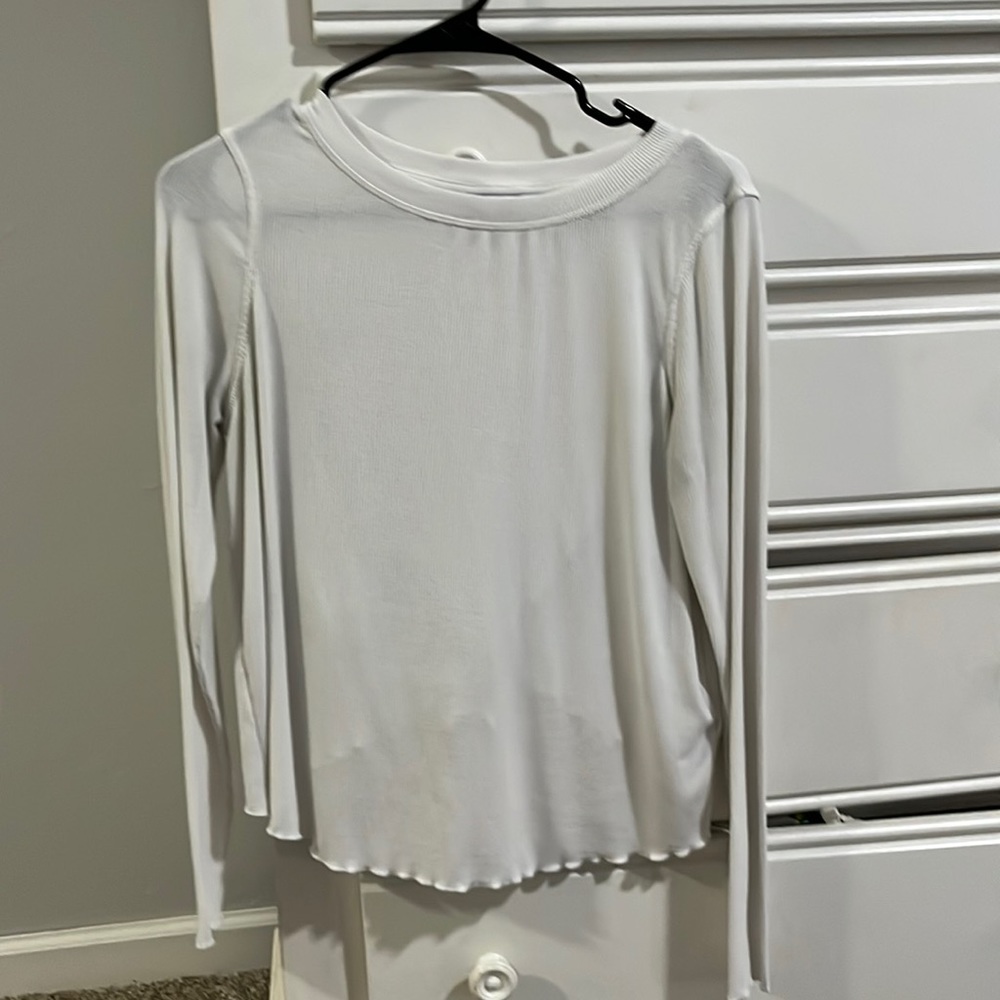 White shirt with ruffled edges crossover